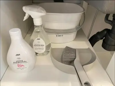 a counter top with a bottle of soap and a whisk at Vélin - Chinatown in Khlong San