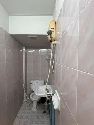 a bathroom with a toilet and a sink at Bella Bella House in Bangkok