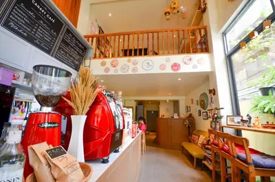 a restaurant with a red blender on a counter at Good Day Hostel in Bangkok