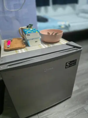 a counter with a bowl on top of a cpu at 204 Olan Place Spacious Studio with Wi-fi near BTS Skytrain in Bangkok