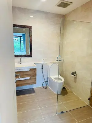 a bathroom with a toilet and a sink at New Ekamai Thonglor Luxury Home near 711, BTS, Mall in Khlong Toei
