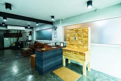 a large room with a desk and a table at XX GO INN Khaosan Road BKK โกอินน์ ตรอกข้าวสาร in Bangkok