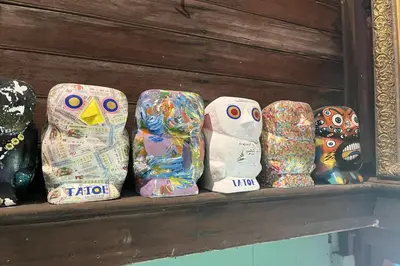 a group of owls are lined up on a shelf at 64 Sweet Home Dusit BKK in Bangkok