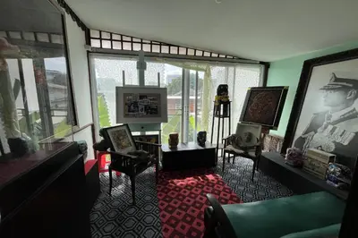 a living room filled with furniture and a large window at 64 Sweet Home Dusit BKK in Bangkok