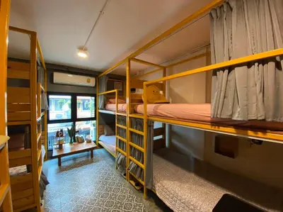 a group of bunk beds in a room at The Space Hometel - Women Only in Pom Prap