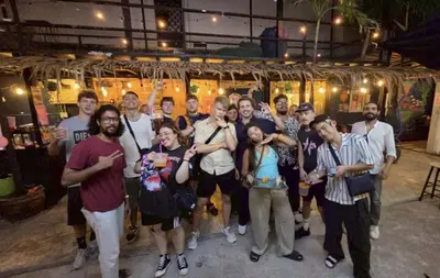a group of people posing for a picture at AREA81 HIDEOUT Hostel Khaosan in Bangkok
