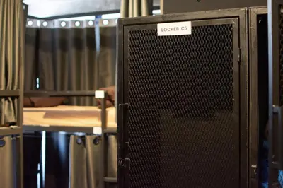 a computer screen with a sticker on it in a room at AREA81 HIDEOUT Hostel Khaosan in Bangkok