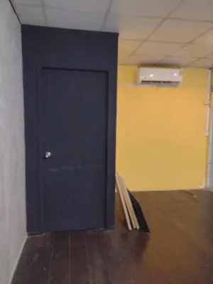 a black door in the corner of a room at 362 สวนอ้อย5 in Dusit