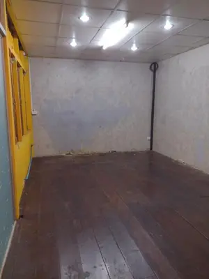 an empty room with a wooden floor and lights at 362 สวนอ้อย5 in Dusit