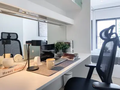 an office with a desk with a black chair at Deluxe Suite 1BR Ultra Fast WiFi BTS Thong Lor in Bangkok
