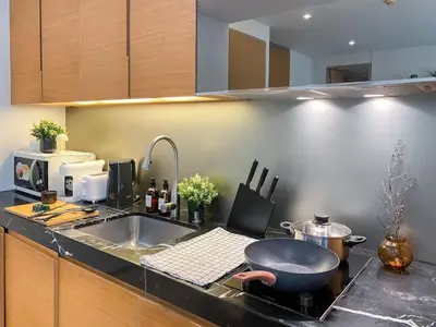 a kitchen with a sink and a bowl on a counter at Transquil Residents 65 SQM - Ultra Fast Wifi - Silom in Bangkok