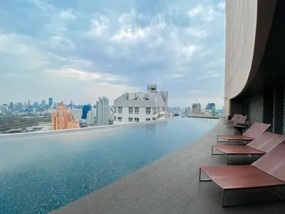 a swimming pool on the roof of a building at Stylish Riverview 1BR - Ultra Fast WiFi - Phrom Phong in Bangkok