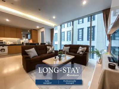 a living room with two couches and a table at Extravagant Apt 65 sqm 1BR - Ultra Fast Wifi - Silom in Bangkok