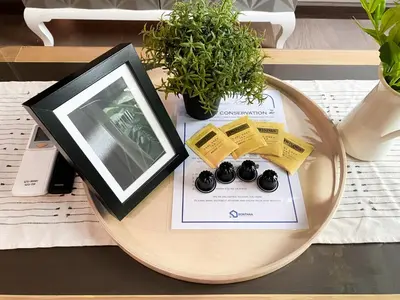 a table with a tablet on top of a table at Tropical Paradise 1BR - Ultra Fast Wifi - Thong Lo in Bangkok