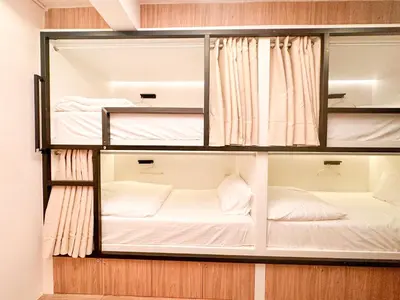 a room with three bunk beds in it at Bangkok Neighborhood Hostel in Bangkok