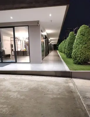 an empty hallway of a building at night at 35 Bow Hotel in Ban Bang Bamru