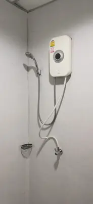 a water hose hooked up to a wall at XX GO INN Khaosan Road BKK - Grand Palace in Bangkok