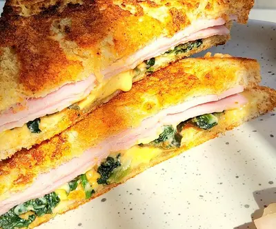 two halves of a sandwich with ham and spinach at Hiddenwoods in Bang Chak