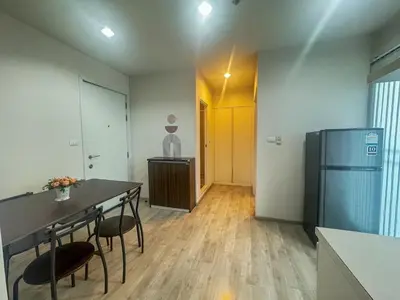 a kitchen with a table and chairs and a refrigerator at Minimal 2 BR next to IKEA, Central Westgate Bangyai in Ban Bang Krabu