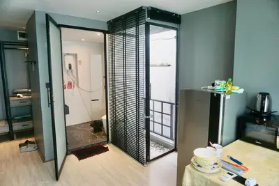 a bathroom with a mirror in a room at Hash Apartment Silom Soi 3 triple room in Bang Rak