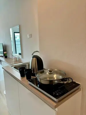 a pot sitting on top of a stove in a kitchen at 5 mins to Ari - Sutthisan in Bang Su