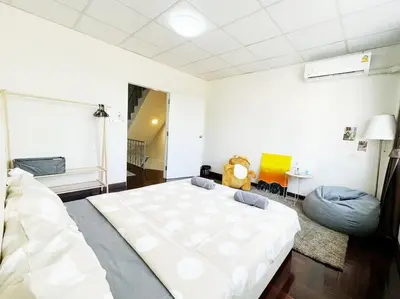a bedroom with a large white bed in a room at 5BR House 8Beds, Ekkamai BTS 12mins walk, 711, shopping mall in Bangkok