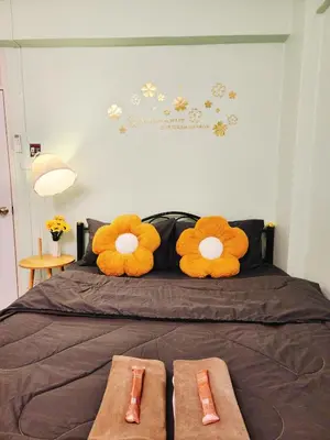 a bed with two stuffed animals on top of it at 807-STP Homely room Free Wi-Fi and Near BTS line in Ban Yang
