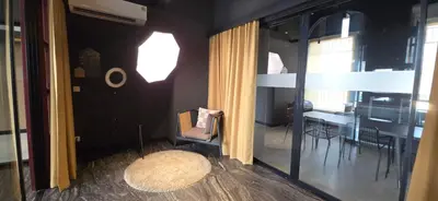 a room with a dining room with a table and a chair at The Chapter One Lifestyle Condo in Bang Khen