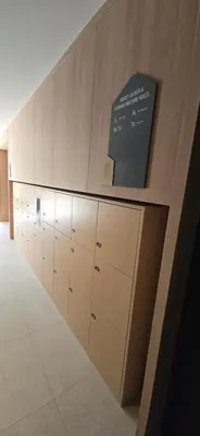 a room with a row of cabinets and a wall at The Chapter One Lifestyle Condo in Bang Khen