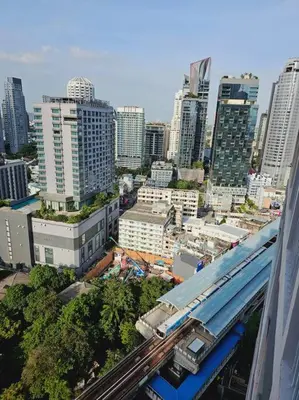 a view of a city with a train on the tracks at 1BR at ThongLor BTS overlooking city with Workspace in Bangkok