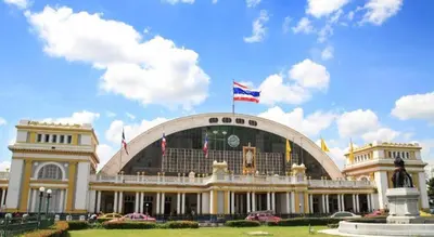 a large building with a flag on top of it at 168 Hostel in Bangkok