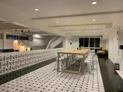 a dining room with a table and chairs at KOWTHA RIVERTEL in Bangkok