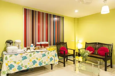 a room with a table and two chairs and a table and a table and chairs at Prince House in Bangkok