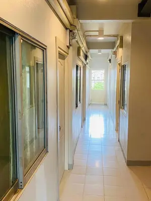 a hallway of a building with a long corridor at Lemon Tree Hostel Khaosan in Bangkok