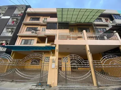 a building with a balcony on the side of it at Meriton101 in Bangkok