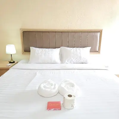 a bed with two rolls of toilet paper on it at Omni Suites 1Bed #702A in Bangkok