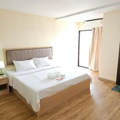 a bedroom with a large bed with two dishes on it at Omni Suites 1Bed #702A in Bangkok