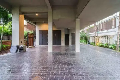 an empty building with a brick floor and pillars at Luxury Pool Villa with Jacuzzi & Lift by Thonglor in Bangkok