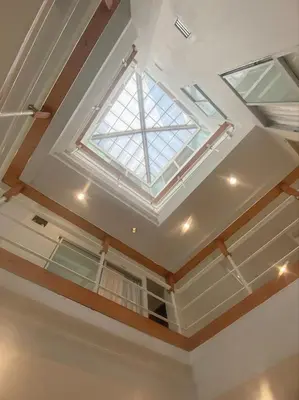 a skylight in a room with a ceiling at Jo Hometel in Lak Si