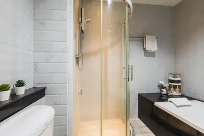 a bathroom with a shower and a toilet and a sink at BKK Sukumvit71 1 Bed 2 Bath 1 Living 1 Kitchen in Bangkok