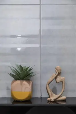 a plant and a statue next to a vase at BKK Sukumvit71 1 Bed 2 Bath 1 Living 1 Kitchen in Bangkok