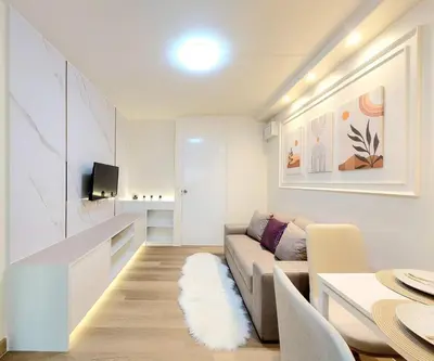 a living room with a couch and a table at Joyful room in Ban Song Hong