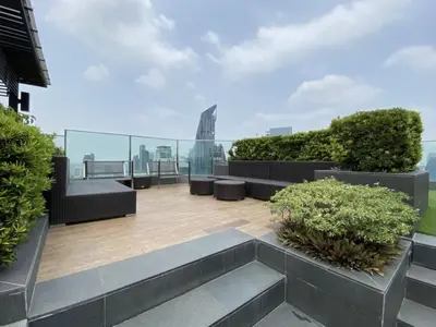 a balcony with benches and a view of the city at Urban High-Rise - Ultra Fast WiFi - BTS Phrom Phong in Bangkok