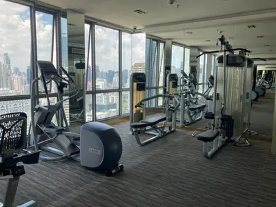 a gym with cardio equipment in a building at Urban High-Rise - Ultra Fast WiFi - BTS Phrom Phong in Bangkok