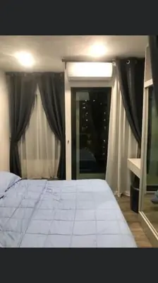 a bedroom with a white bed and a window at Ppppp in Bang Khen
