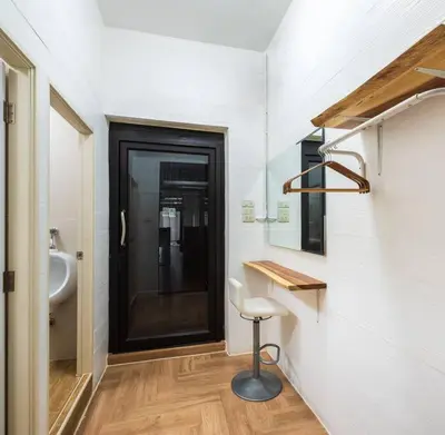 a bathroom with a sink and a stool in it at 499 House Villa in Bangkok