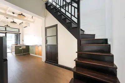 a stairway leading to a room with a hallway at 499 House Villa in Bangkok