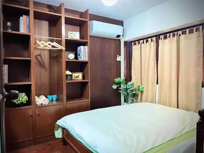 a bedroom with a bed and a book shelf at 5BR House BTSNana Nanaplaza City center MBK Center world in Bangkok