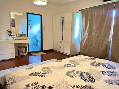 a bedroom with a bed and a bathroom with a sink at 5BR House BTSNana Nanaplaza City center MBK Center world in Bangkok