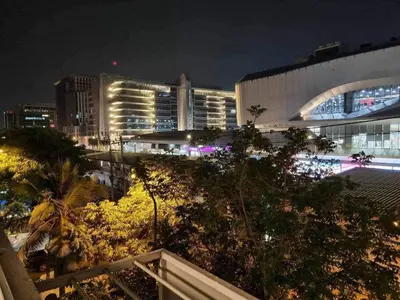 a view of a city skyline at night at Popular Muang Thong Thani Condo, Building T9, Floor 4, Room 36 in Thung Si Kan